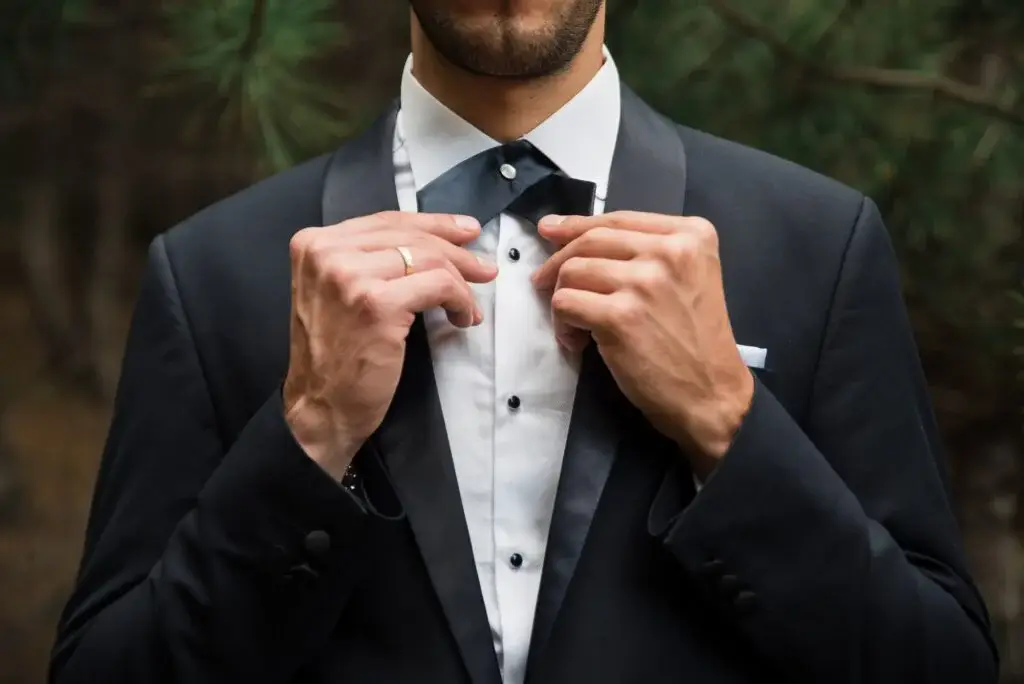 groom at wedding tuxedo in the forest